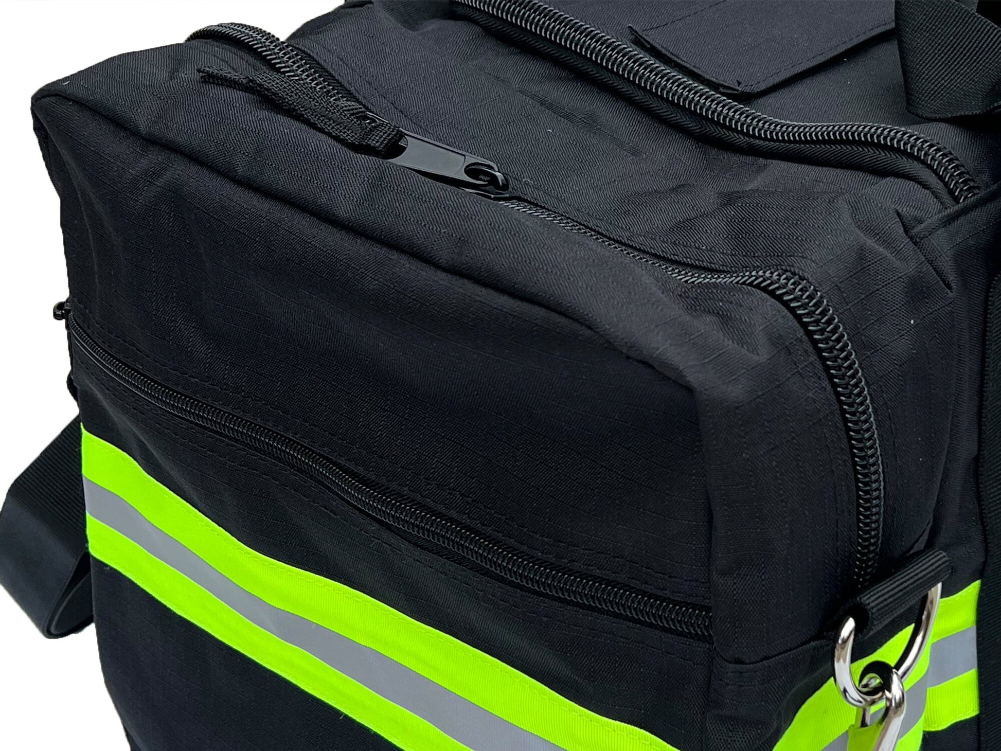 End view of Black duffel bag showing yellow and silver reflective trim and zipper pocket. Zipper also on top and side of the end compartment.