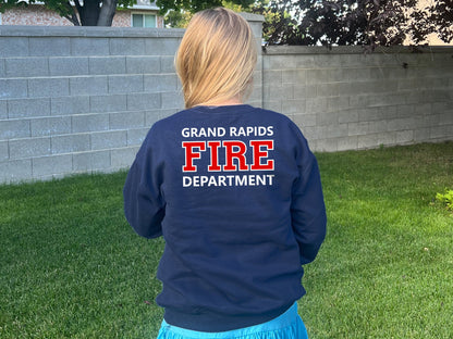 A navy blue sweatshirt with the words &#39;Grand Rapids Fire Department&#39; printed on the back in white and red lettering.