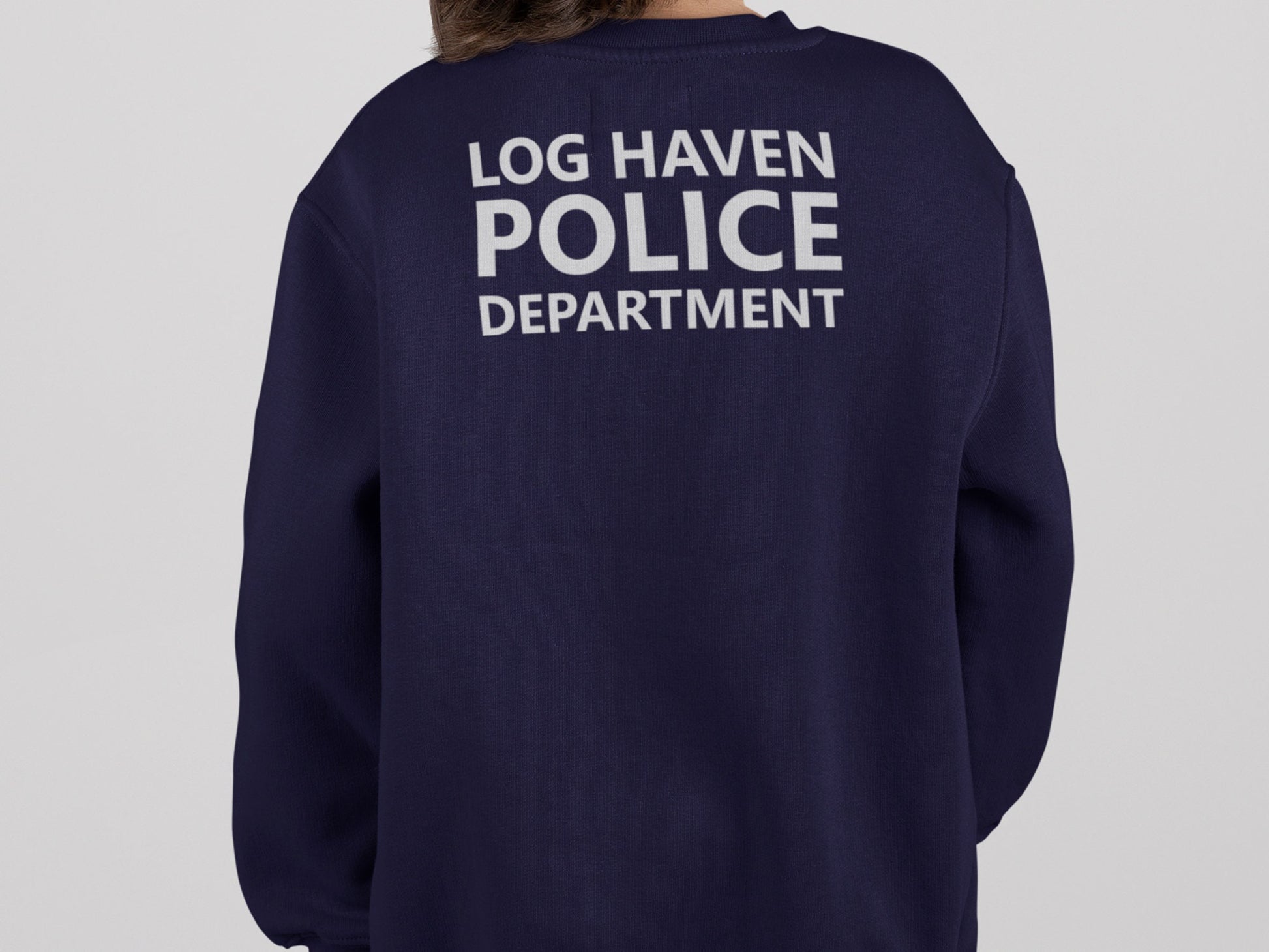 Back view of navy blue sweatshirt with the words &#39;Log Haven Police Department&#39; written in silver text.