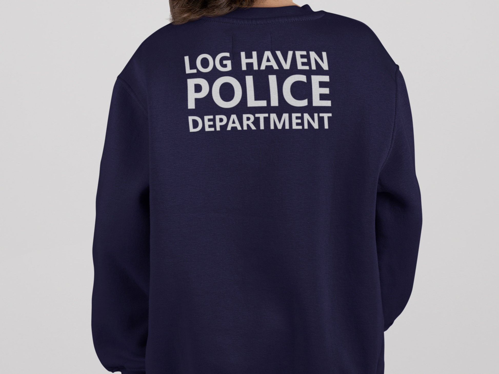 A navy blue sweatshirt with the text &#39;LOG HAVEN POLICE DEPARTMENT&#39; printed in silver on the back.