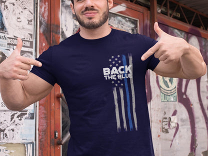 A navy blue t-shirt with a white and blue American flag design. The flag has a thin blue line running down the center. The text &#39;Back the Blue&#39; is printed in white on the t-shirt.