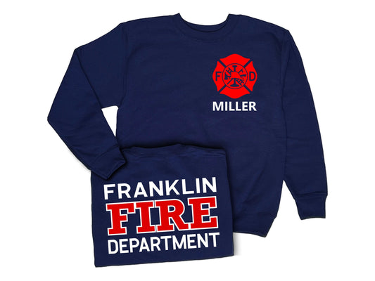 Navy blue crew neck sweatshirt with red Maltese cross on front left chest and the name &#39;Miller&#39; underneath in white. Shirt back has &#39;Franklin Fire Department&#39; in white and red text.