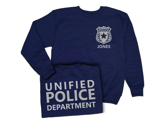 A navy blue youth sweatshirt with a silver police badge on the front that says &#39;POLICE&#39; and &#39;JONES&#39;. The back of the sweatshirt says &#39;UNIFIED POLICE DEPARTMENT&#39; in silver text.