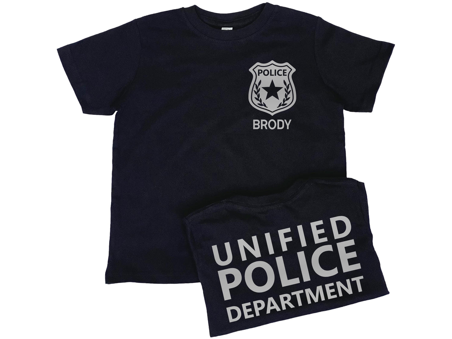 Black short sleeve t-shirt with silver police badge on left chest and the name &#39;Brody&#39; underneath in silver text. Shirt back has &#39;Unified Police Department&#39; in silver text.